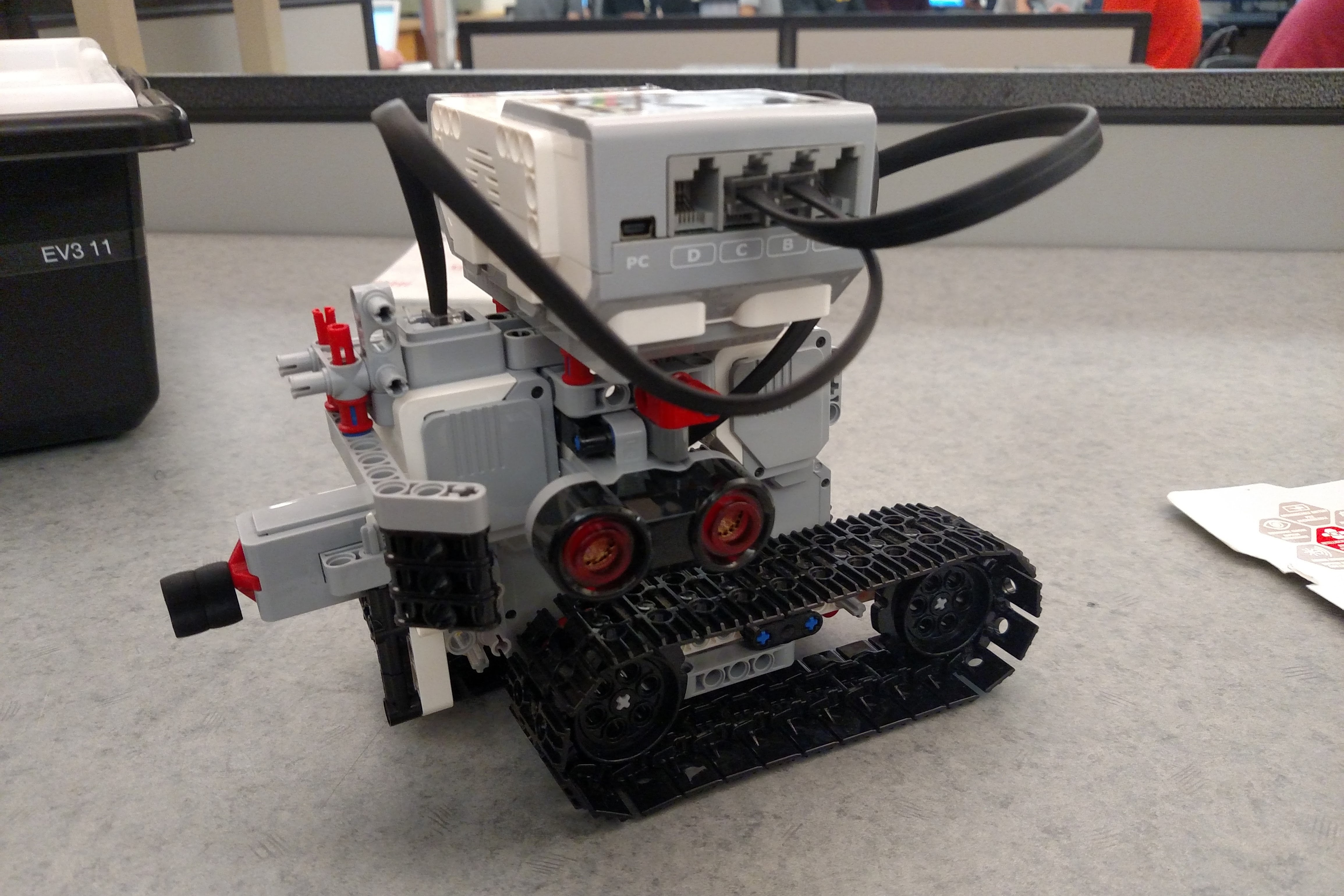 Robot with two tank style treads.